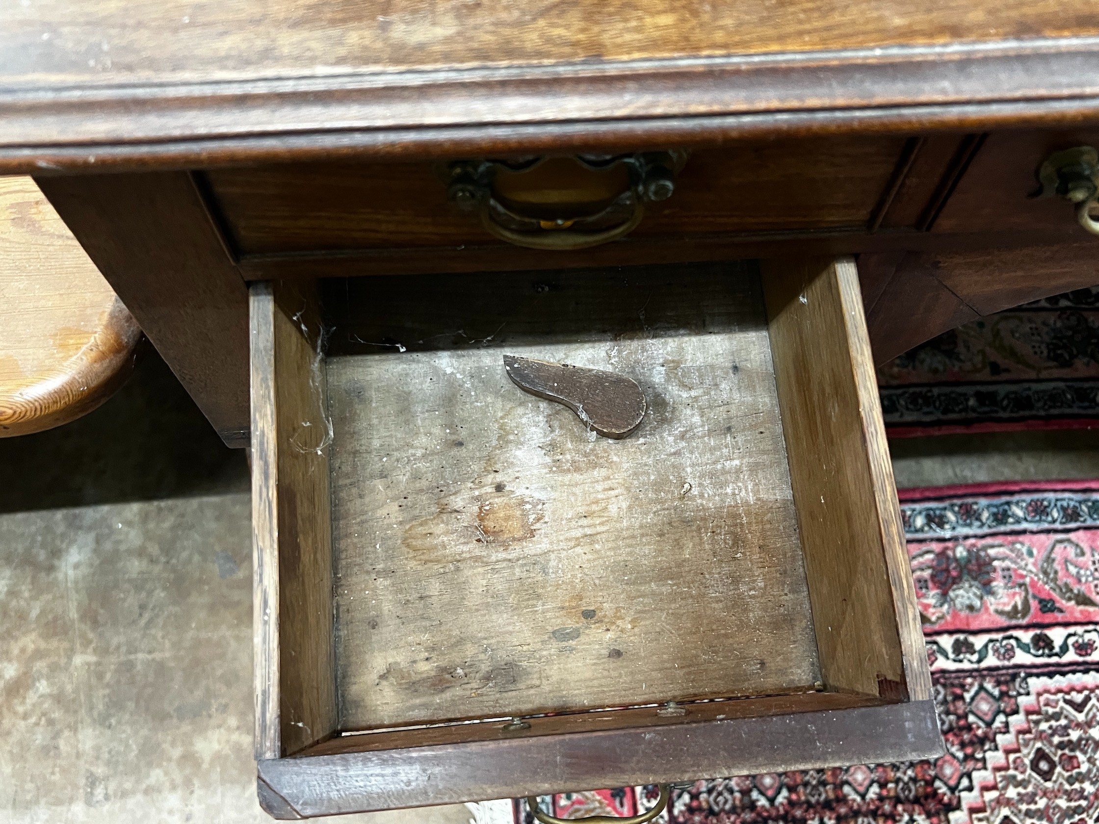 A Regency mahogany kneehole dressing table and a George III banded oak chest of three drawers, width 96cm depth 54cm height 87cm